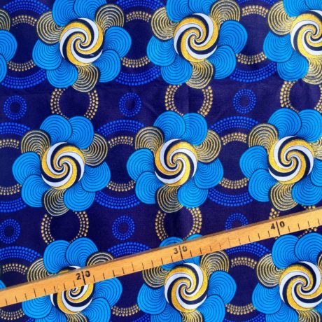 Tissu Wax pailleté bleu doré imprimé Fleurs Spiralées