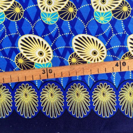 Tissu Wax pailleté bleu doré imprimé Ovales détail bordure