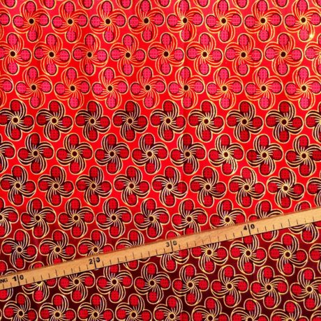 Tissu Wax pailleté dégradé rouge rose doré imprimé Fleurs