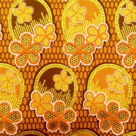 Tissu Wax pailleté jaune orangé marron imprimé 3 Fleurs détail