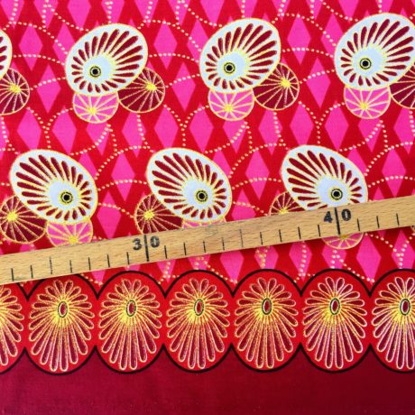 Tissu Wax pailleté rouge rose doré imprimé Ovales détail bordure