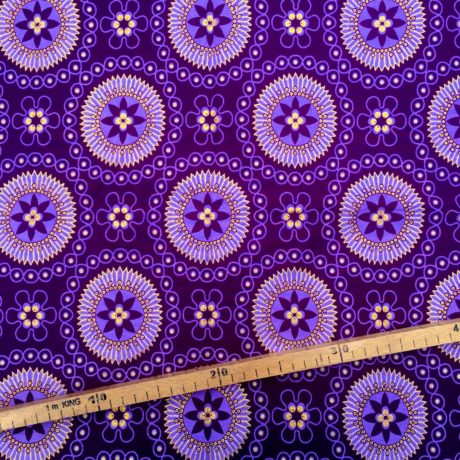 Tissu Wax pailleté violet doré imprimé Fleurs encerclées
