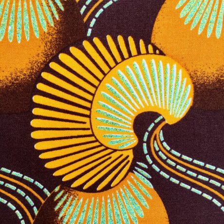 Tissu Wax pailleté marron jaune orange imprimé Coquillages détail