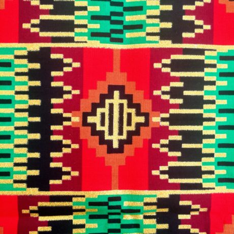 Tissu Wax pailleté rouge vert imprimé Aztèque détail