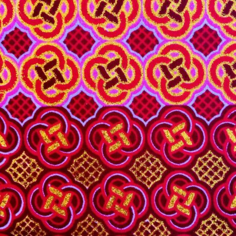 Tissu Wax pailleté fuchsia orangé imprimé Celte détail bordure