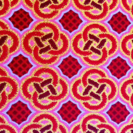 Tissu Wax pailleté rouge orangé imprimé Celte détail