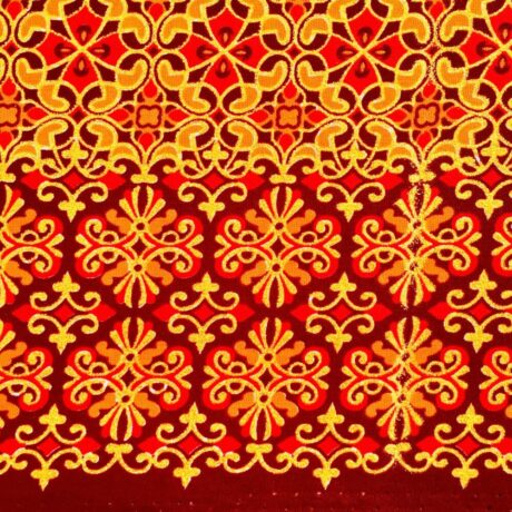 Tissu Wax pailleté rouge orangé imprimé Croix florale détail bordure