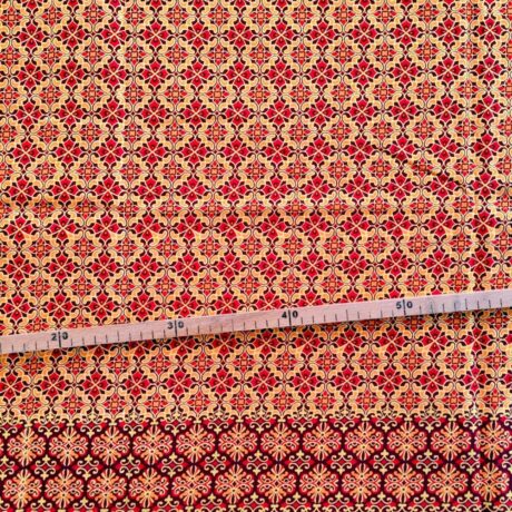 Tissu Wax pailleté rouge orangé imprimé Croix florale