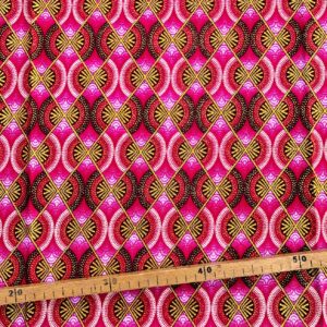 Tissu Wax pailleté rose imprimé Demi-lunes