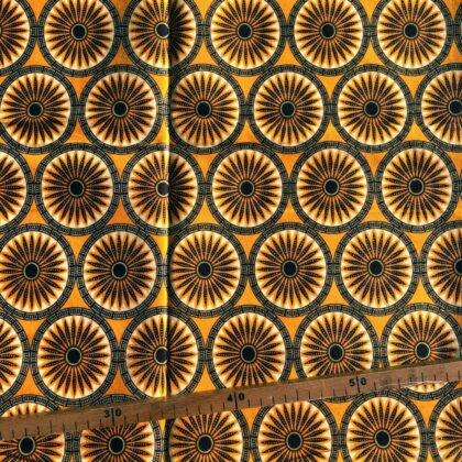 Tissu Wax pailleté jaune orangé imprimé Rosaces